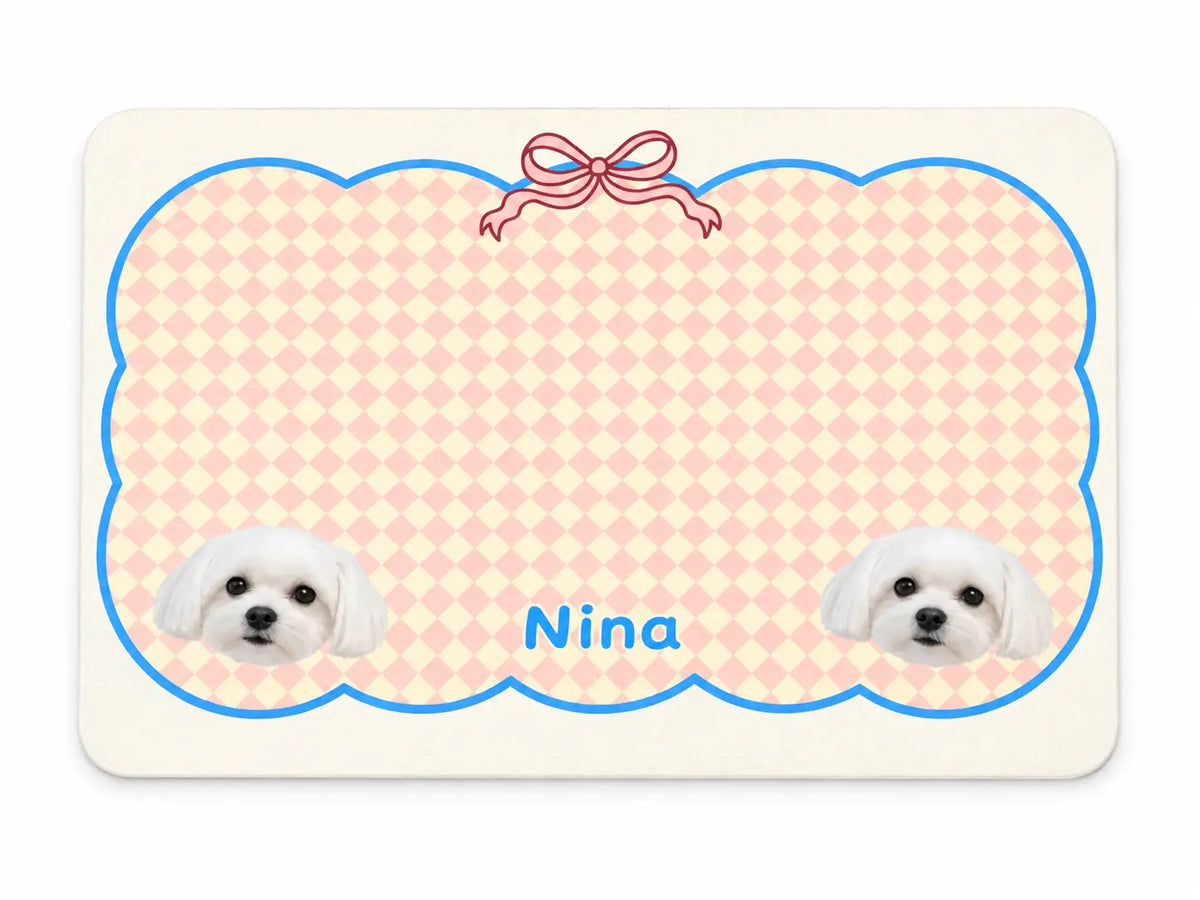 Custom waterproof non-slip pet feeding mat featuring pink argyle pattern, cute ribbon bow, and personalized pet photos