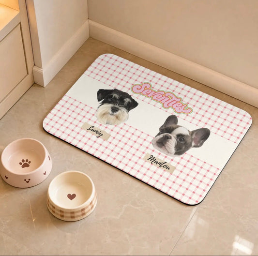 Non-slip personalized pet food and water bowl placemat placed on home floor next to bowls