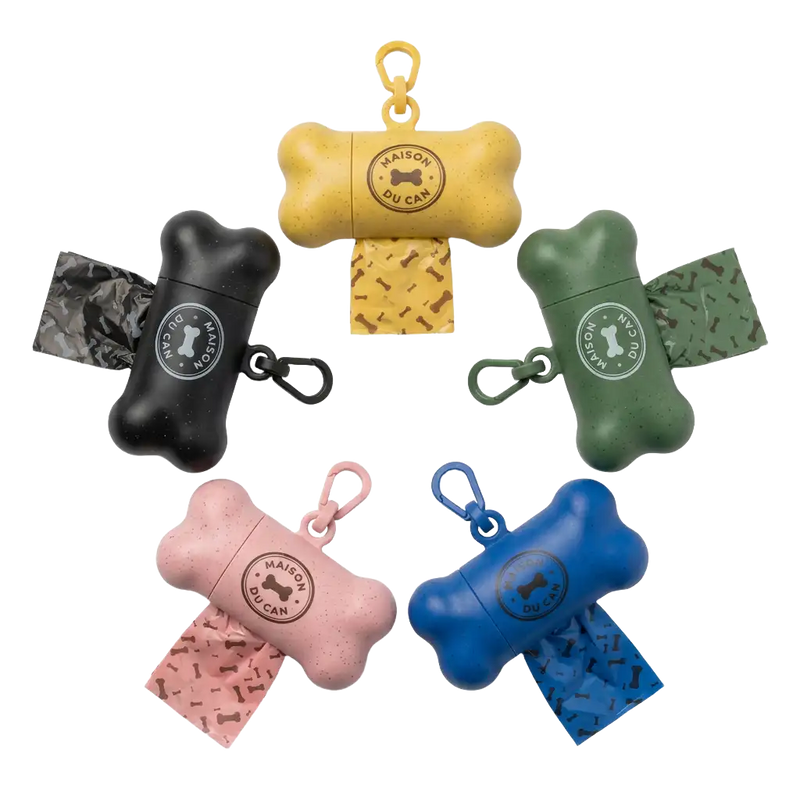 Custom branded bone-shaped dog poop bag dispensers with logo. Manufactured by Petailor for Maison Du Can boutique in Madrid.