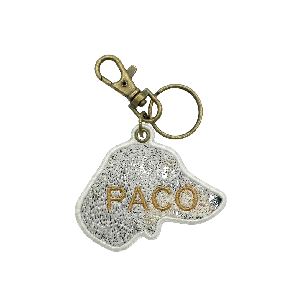 Back view of Petailor custom embroidered keychain showing personalized pet name detail - handcrafted fabric reverse side
