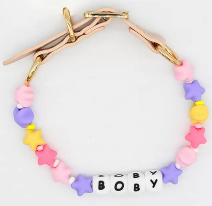 Close-up of colorful letter beads and premium leather strap on Petailor custom collar